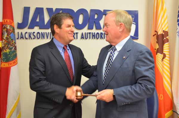 JAXPORT Immediate Past Board Chairman Ed Fleming (right) passes the gavel to incoming Chairman John Falconetti