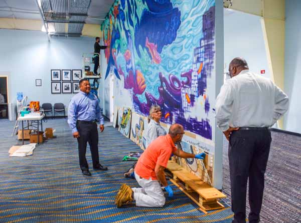 JAXPORT executives check out progress of a one-of-a-kind art installation at JAXPORT Cruise Terminal