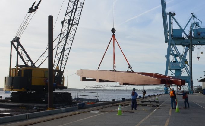 Large crane part is lifted onto a barge at JAXPORT