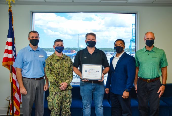 JAXPORT employee Brandon Blanton holds his ESGR recognition