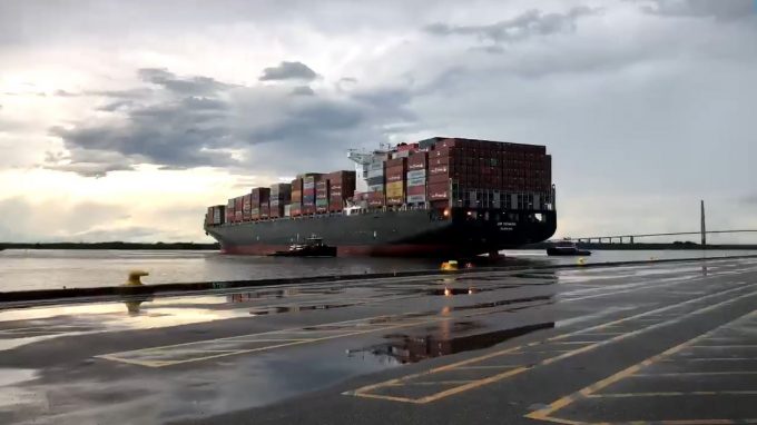 Large container ship turning at the berth