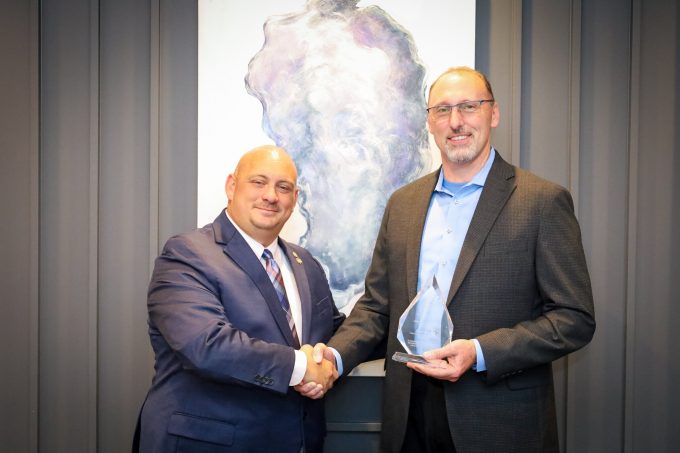 Propeller Club – Port of Jacksonville Outgoing President Kenny Santos (left) presents JAXPORT COO James Bennett, P.E., with the 2023 Maritime Person of the Year award during the group’s Change of Command Ceremony Thursday in Jacksonville.